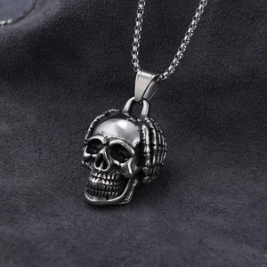 Hip hop style silver stainless steel necklace featuring a scratching head emoji skull pendant