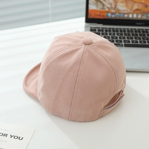 Detail view of pink corduroy baby baseball cap with adjustable back strap and soft brim