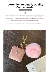 Detail of pink faux lizard skin mini bag pendant with soft fluffy fur ball and gold hardware