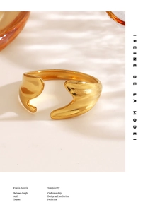 Detail of irregular wave gold-plated stainless steel ring with elegant shadow effect