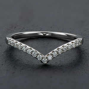 Macro shot of V-shaped S925 sterling silver ring with sparkling round cubic zirconia