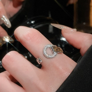 Macro detail of silver geometric ring featuring a sparkling cubic zirconia micro-pave circle