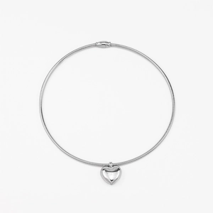 Polished silver heart pendant on a minimalist metal collar necklace for women