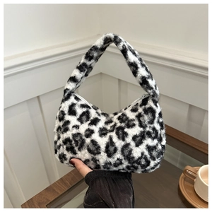 Detailed view of the soft black and white leopard print plush texture on this chic hobo bag