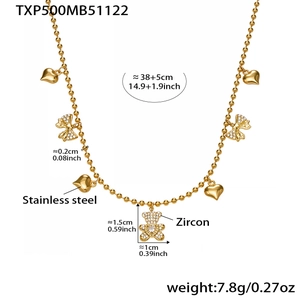 Detail of gold stainless steel necklace with zircon bear and bow heart charm pendants