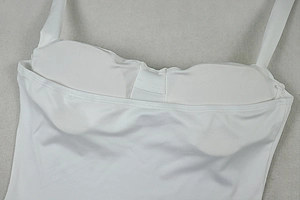 Detail view of the white halter dress inner lining with built-in padded cups