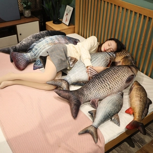 Detail of 3D digital print lifelike fish plush pillow being hugged in a cozy bedroom