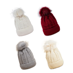 Pink and neutral cable knit beanies with fluffy pom-poms for winter warmth