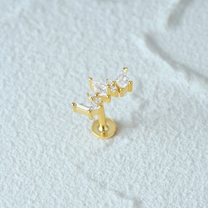 Detailed macro view of gold S925 silver flat back labret stud with zircon moon design