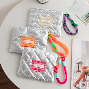 Quilted silver PU leather cosmetic bags with colorful braided ropes and metallic finish