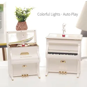 White upright piano music box with rotating dancing ballerina and built-in mirror storage
