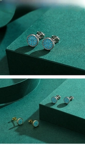 Macro detail of S925 sterling silver turquoise stud earrings in silver and gold finishes