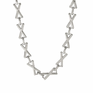 Detailed close-up of the silver-toned X-shaped geometric link chain necklace