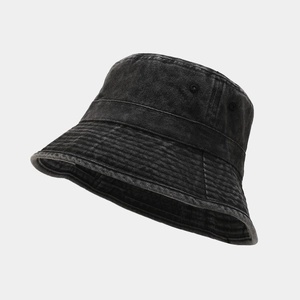 Detail of washed cotton bucket hat showing distressed texture and circular stitching