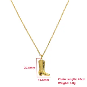 Golden cowboy boot pendant necklace with floral relief patterns on 45cm chain