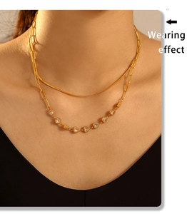 Wearing effect of golden double-layer necklace with snake chain and heart zircon pendant