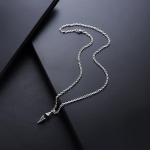 Minimalist silver starburst necklace with blue gemstone pendant and sleek O-link chain