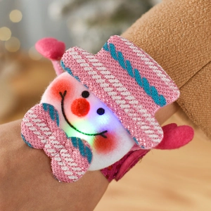 Close-up of glowing LED Christmas slap bracelet featuring a sequined cartoon snowman