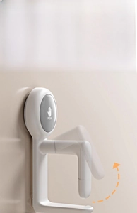 White wall-mounted hook detail showing spring-loaded push mechanism and adjustable clamp