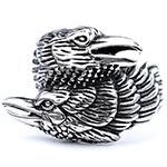 Detail of vintage gothic raven bird ring in silver finish with feather texture engraving