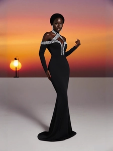 Elegant off-shoulder black fishtail evening gown with sparkling silver rhinestone neckline