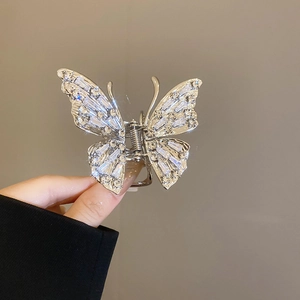 Detailed view of silver butterfly hair claw clip with shimmering cubic zirconia crystals