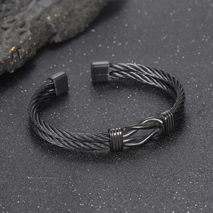Men's black twisted cable wire cuff bracelet in minimalist stainless steel industrial style