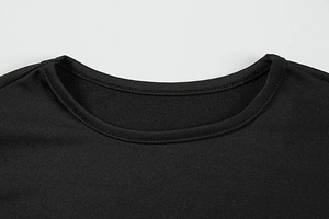 Macro detail of the round neck with reinforced double-needle stitching on black knit dress