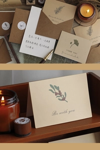 Detailed view of vintage plant greeting cards with kraft envelopes and decorative candles