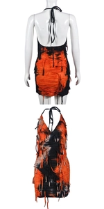 Detail of orange and black tie-dye halter dress featuring punk style fringe and distressed holes