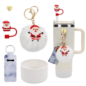 Christmas themed accessory set for tumblers with silicone straw caps and fuzzy pompom charm