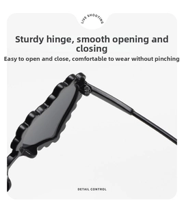 Detail of sturdy metal hinge and wave pattern on heart-shaped kids sunglasses