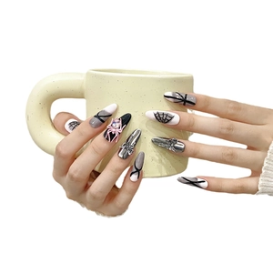 Handmade long almond punk nails with pink spiders, cross charms, and gothic web patterns