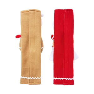 Gingerbread man plush refrigerator handle covers in red and brown festive colors