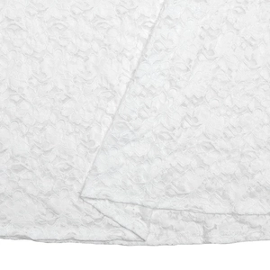 Close-up of white floral lace fabric on high waist skirt showing intricate mesh texture