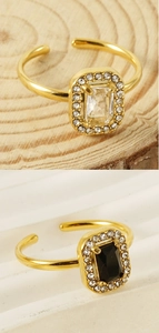 Detailed close-up of gold stainless steel square rings with black and clear zircon stones