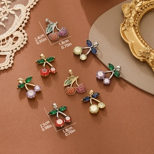 Colorful cherry pendants with zircon inlay on gold plating, shown in various colors