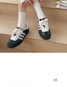 Detail of white cotton crew socks with ribbed elastic cuffs for a soft and seamless fit