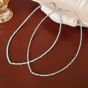 Detail of beaded Amazonite necklace with faceted sky blue beads and silver clasp
