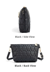 Side and back view of a black heart-quilted crossbody bag with golden zippers