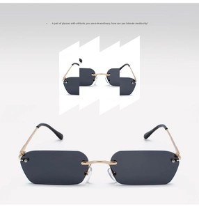 Detail of rimless rectangular sunglasses with gold metal bridge and dark grey lenses