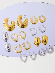 Collection of polished gold and silver geometric earrings with hammered and ribbed textures