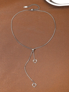 Detail view of silver heart pendant necklace with adjustable box chain and slider bead
