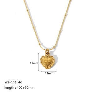 Detail of 12mm gold heart cross pendant on beaded titanium steel chain with size info