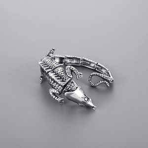 Macro shot of punk style stainless steel crocodile bracelet with vintage silver scales