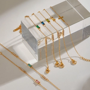 Adjustable gold plated stainless steel cross bracelets with colorful birthstones on acrylic