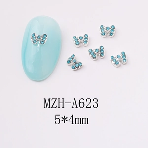 Detail of 5x4mm sky blue alloy bow nail charm with rhinestones for manicure art
