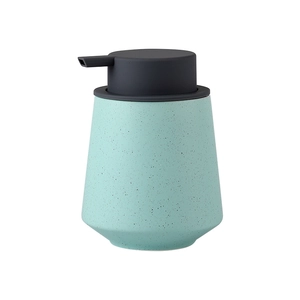 Minimalist mint green ceramic soap dispenser with black spots and matte grey pump