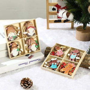 Detailed view of wooden gingerbread man and Santa ornaments in a grid gift box on plush fabric