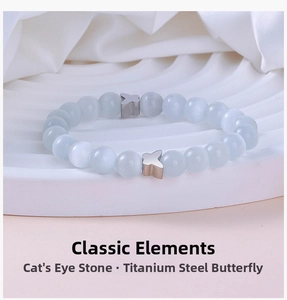 Detailed close-up of cat eye stone beads and stainless steel butterfly charms on the bracelet